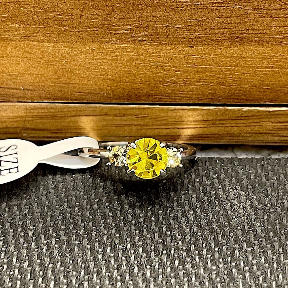 Gorgeous 3 stone ring, yellow center stone